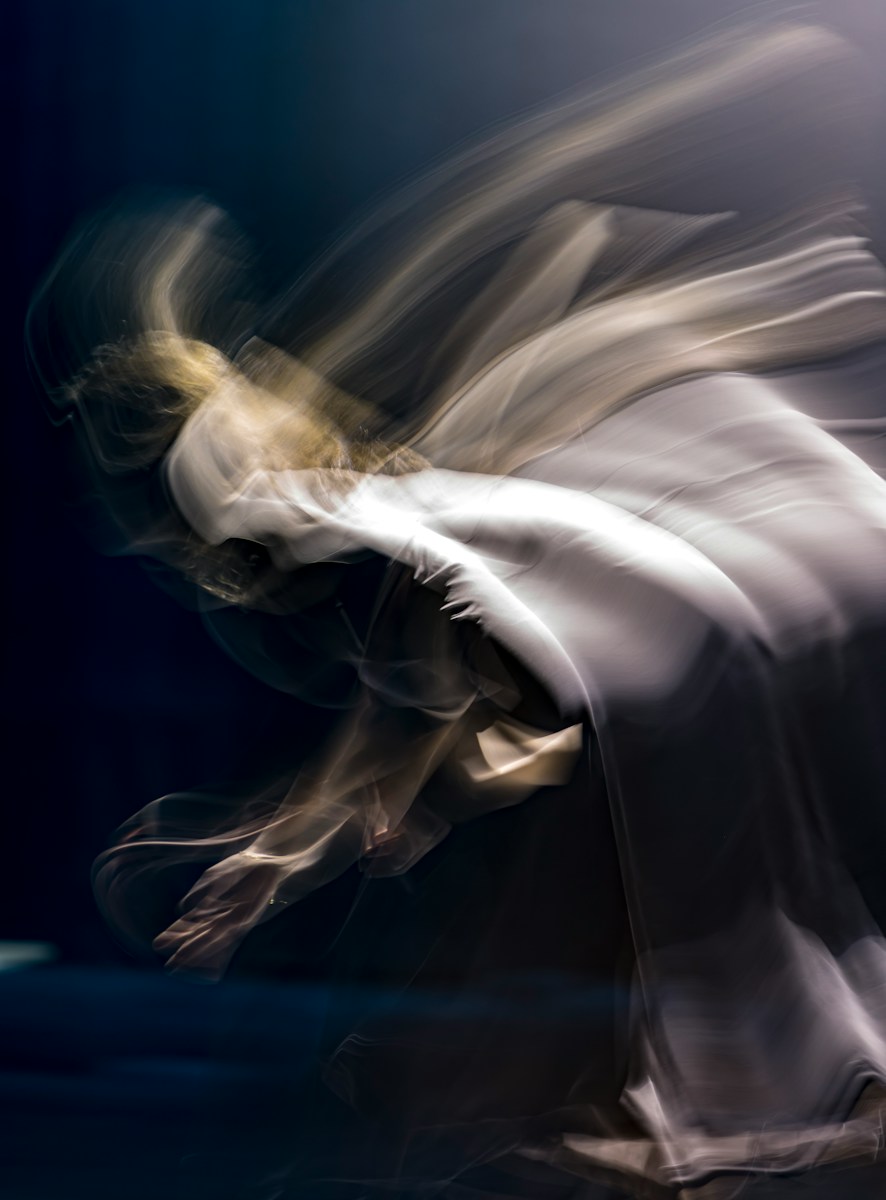 a blurry photo of a person doing a trick